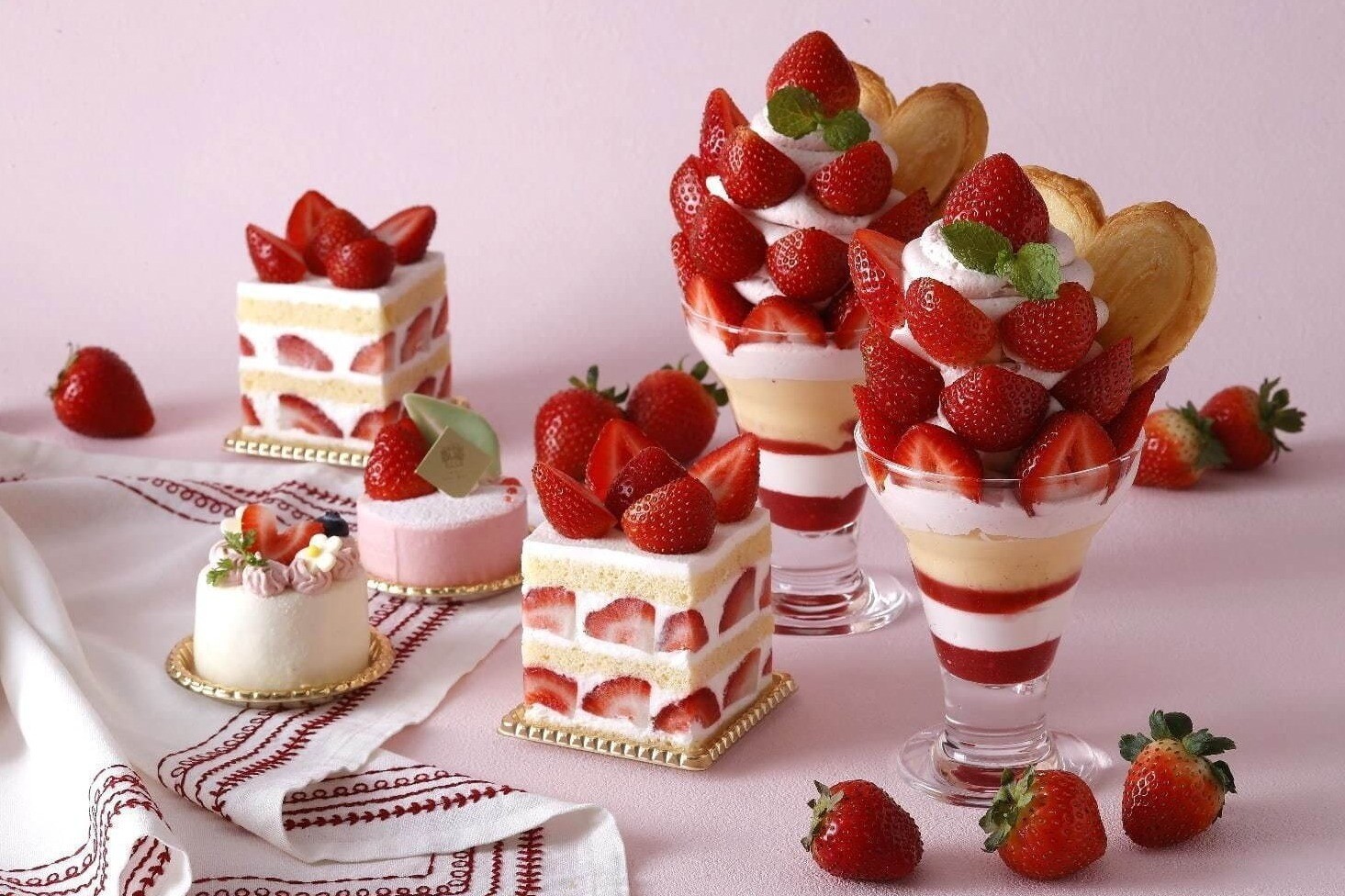 hotel-new-grand-strawberry-fair-with-bright-red-strawberry-sweets-such-as-amaou-two-tiered-shortcake-1700095481.jpg